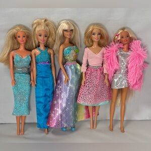 Group of five Barbie dolls in colorful fashion